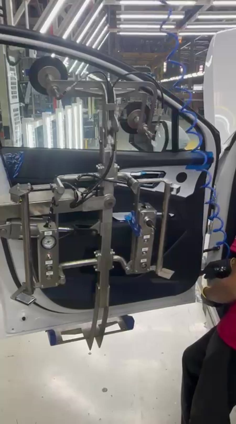 Ovity door gripper holding a car door for fitting